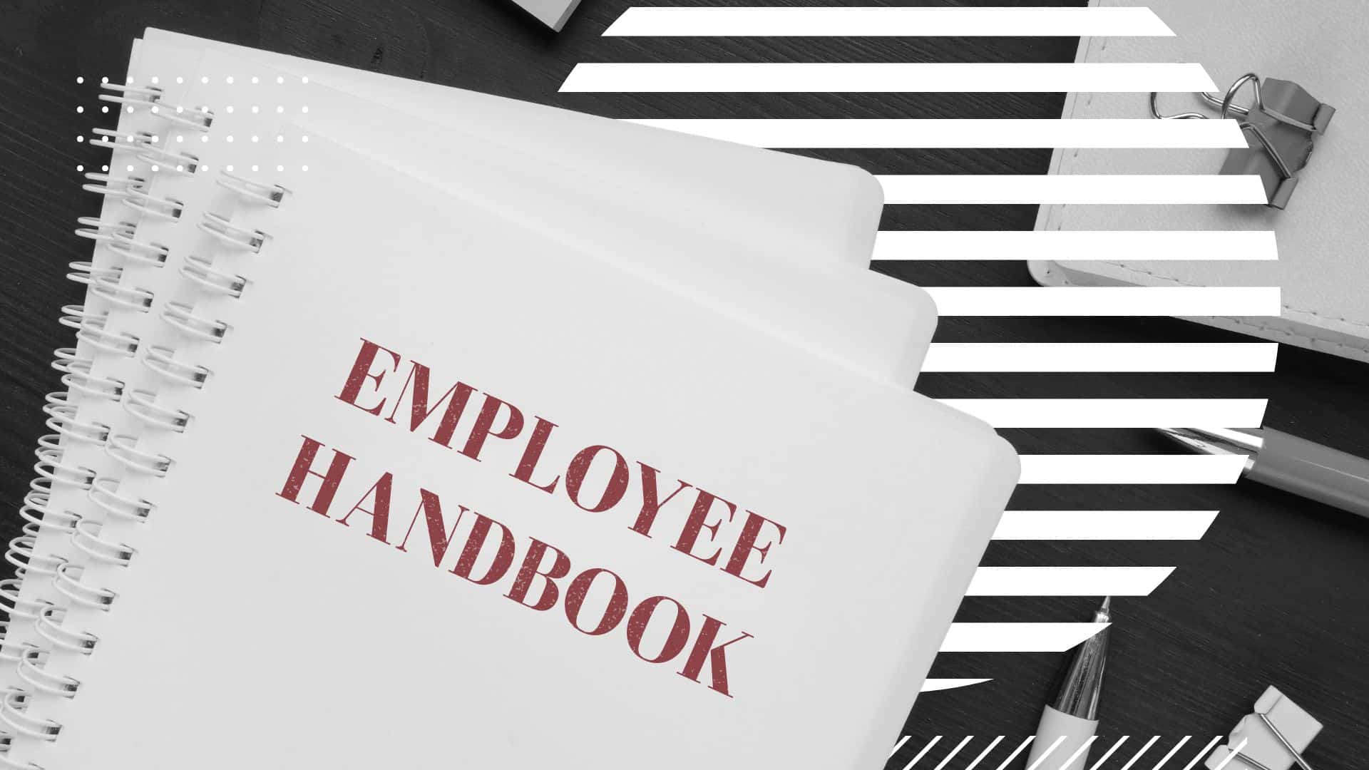 Spiral-bound book labeled "Employee Handbook" on a desk