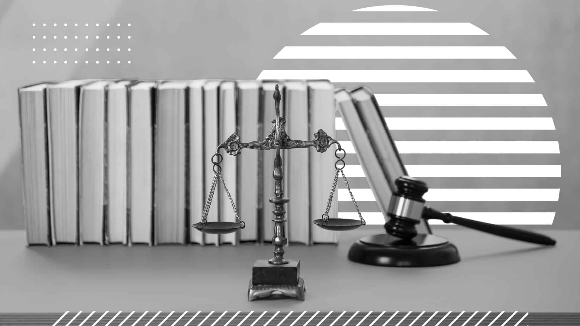 desk with the scales of justice, gavel, and books