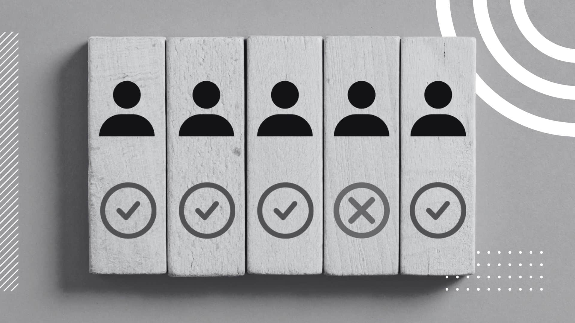 wooden blocks with an illustration icon of a user, undeneath which is a circle with either a check or X-mark in it