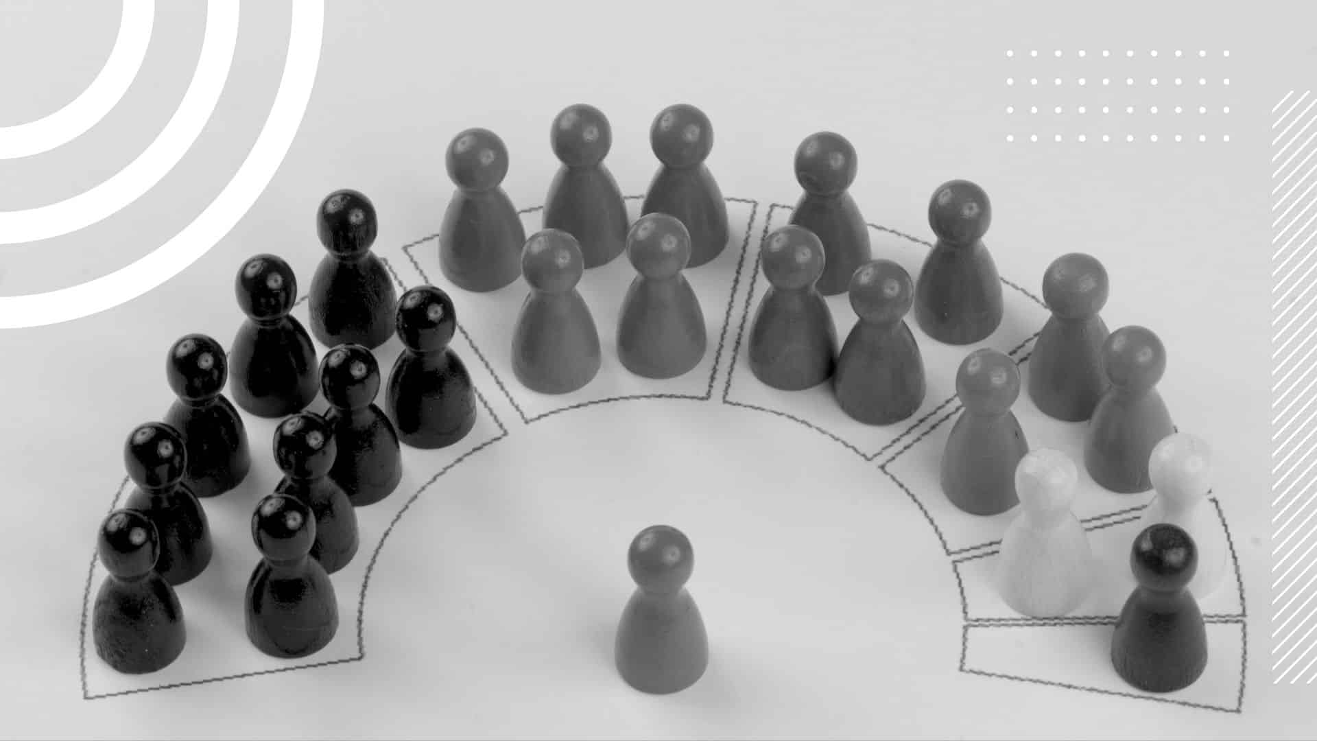 many pawn pieces arranged in a half-arch as though they are a sitting congress with one lone pawn in the center as though it was the speaker