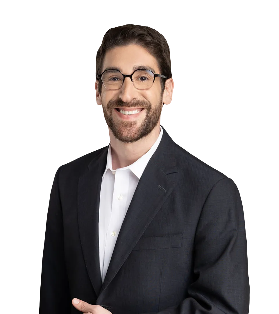 Brian J Levy – man with a beard and glasses, smiling, wearing a black suit jacket