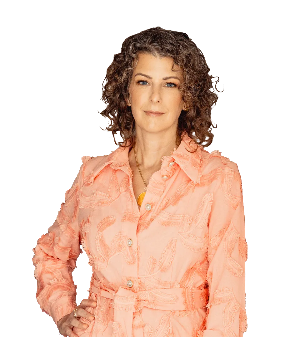 Natalie Lynch — woman with curly hair, wearing a peach blouse