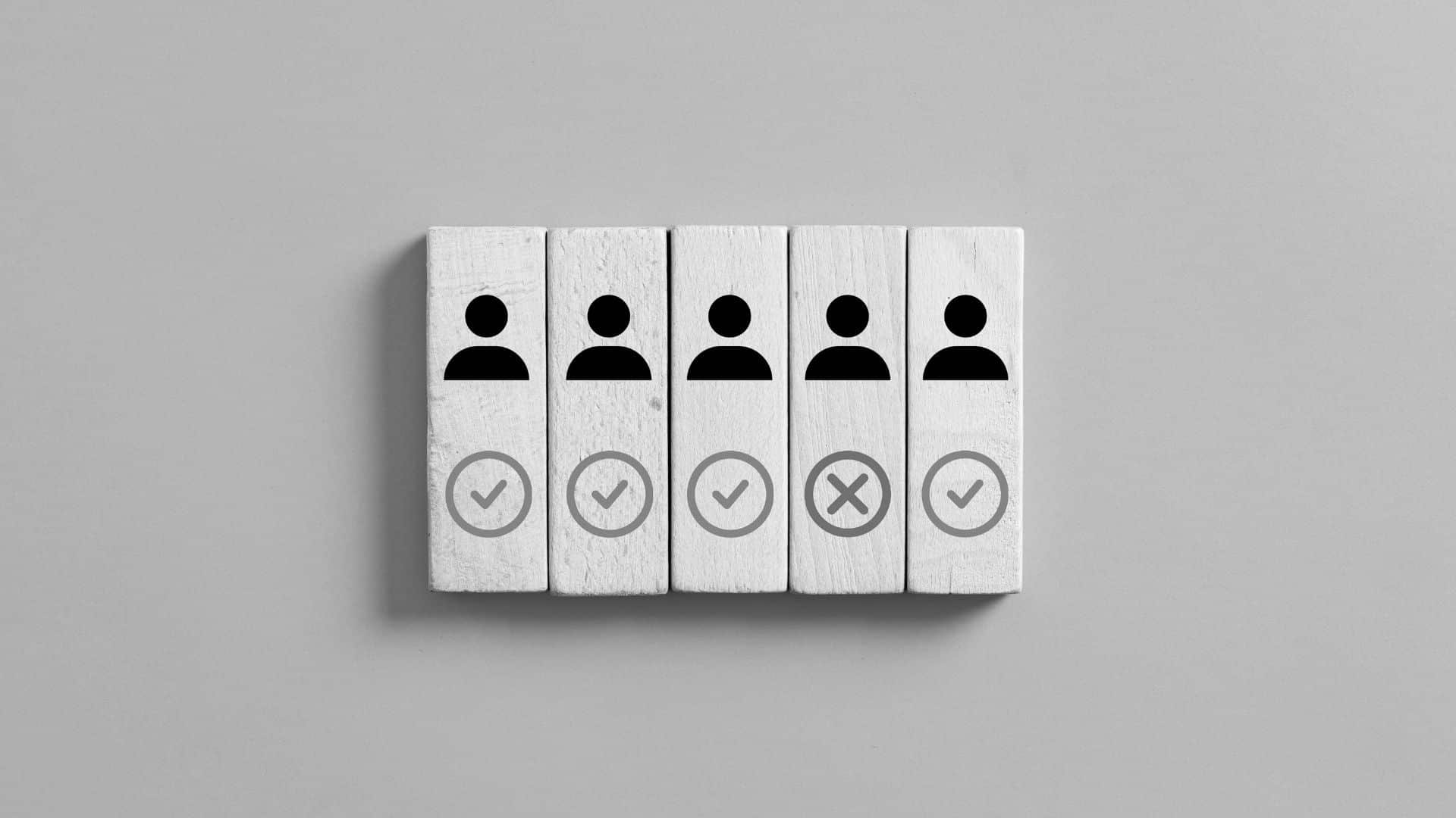 rectangular blocks that have user icons on each, under all but one is a check mark; under one is an x